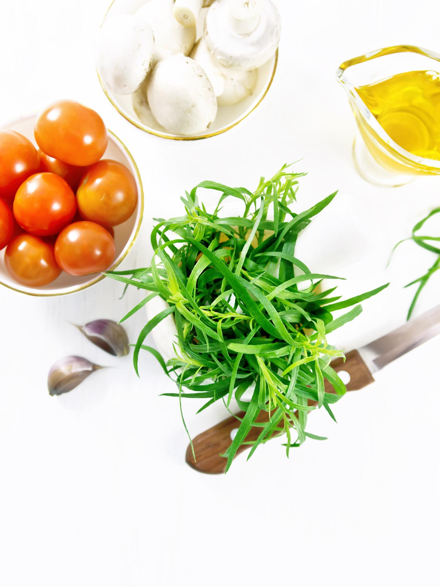 small bowl with freshly chopped herbs and lemon